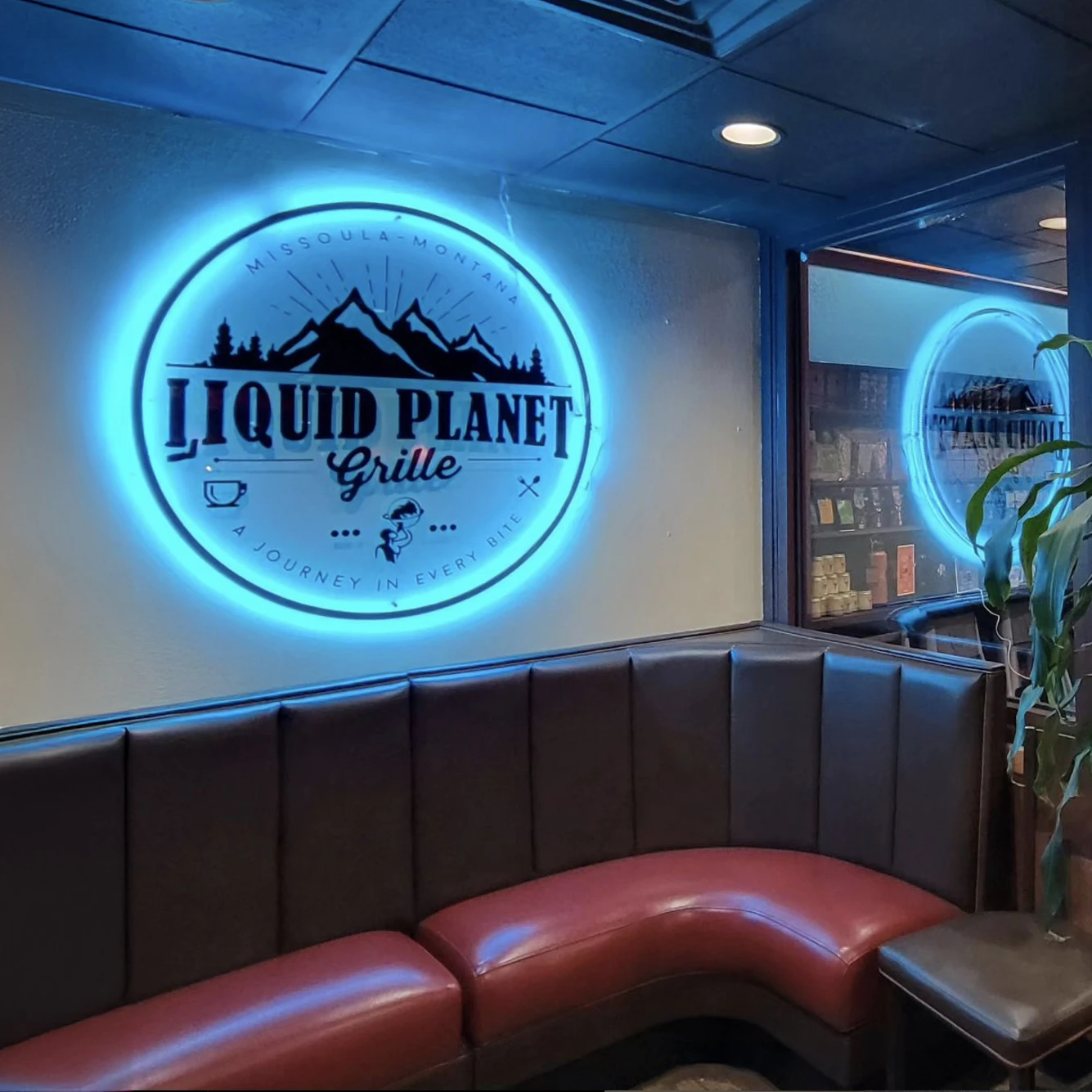 Liquid Planet company neon sign.